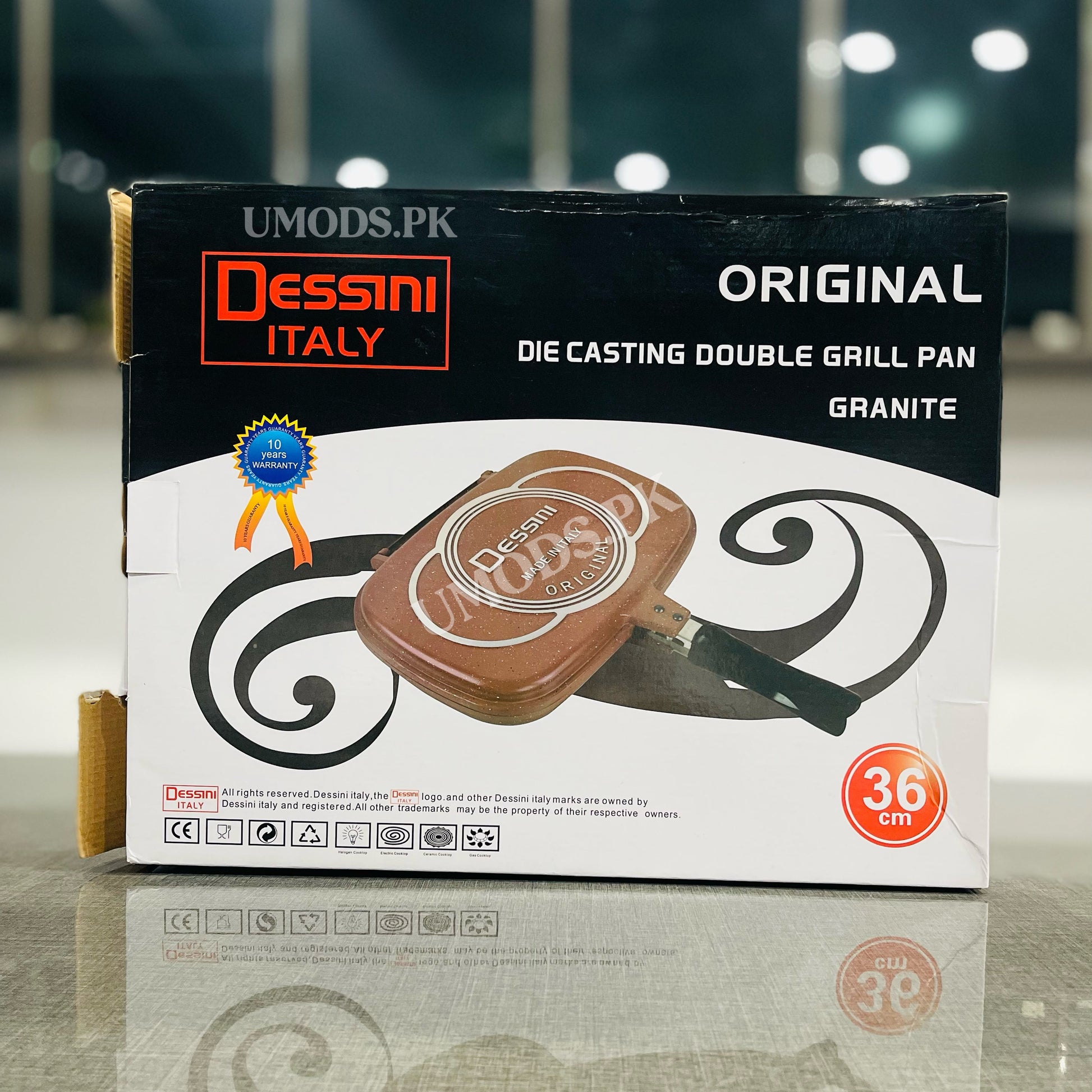 Box of Dessini Italy double grill pan with branding and product details.